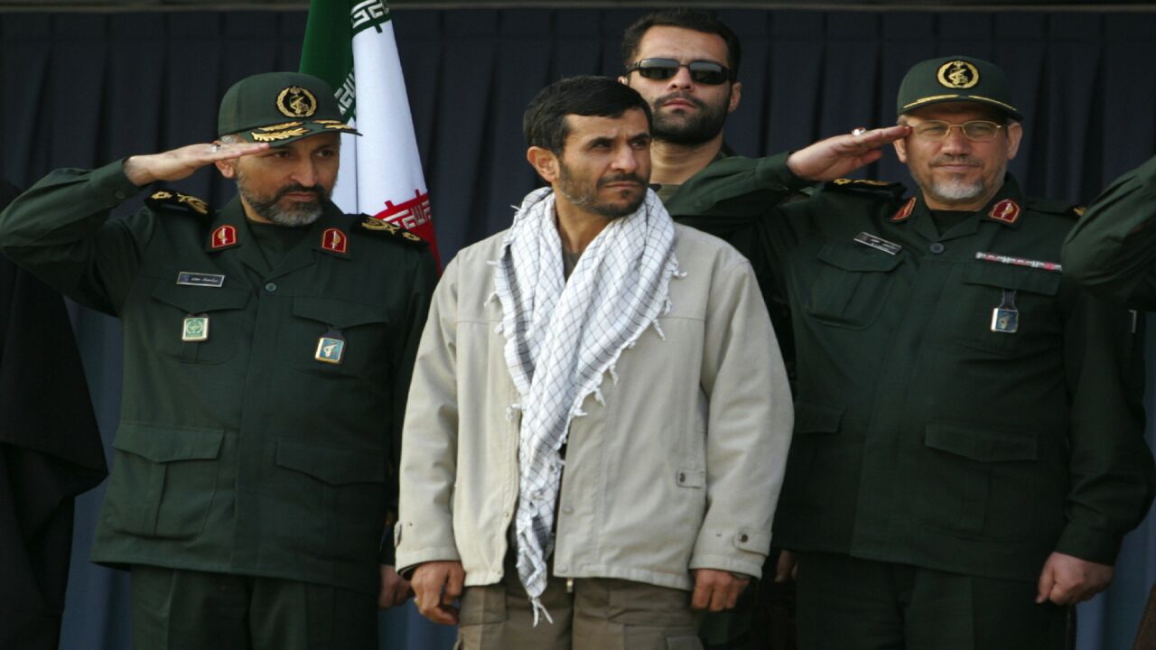 Iranian President Mahmoud Ahmadinejad (C) attends with Revolutionary Guards commander Yahya Rahim Safavi (R) and Basij senior official Mohammad Hejazi (L) a parade held by the Islamic volunteer Basij militia at the mausoleum of the late revolutionary founder Ayatollah Khomeini, just outside Tehran, Nov. 26, 2006. 