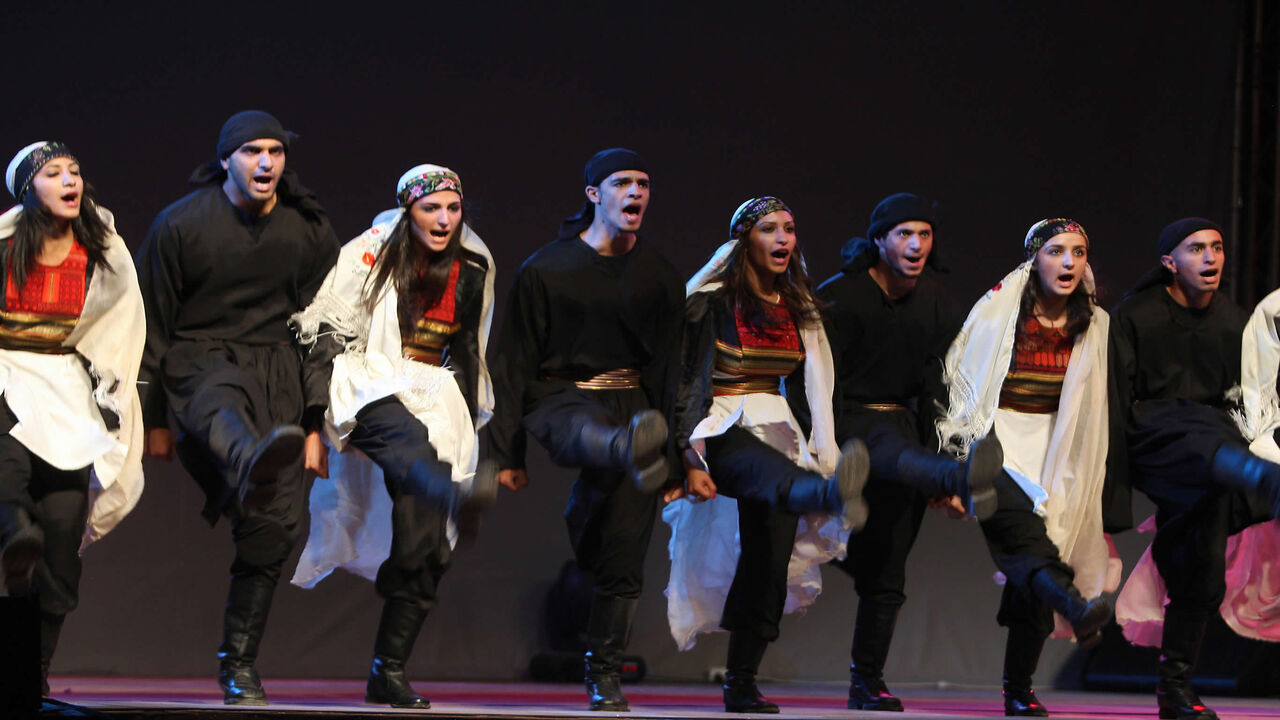 Dancers with El-Funoun Palestinian Popular Dance Troupe perform during the opening night of the Palestine International Festival, Ramallah, West Bank, July 2, 2009.