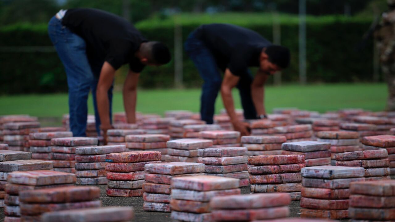 Members of the Panamanian National Aeronaval Service of Panama (SENAN) organize packages of seized drugs in Panama City on May 18, 2109. The SENAN seized 1.5 tons of cocaine inside a container that had Turkey as its final destination at the Cristobal container port in Colon.