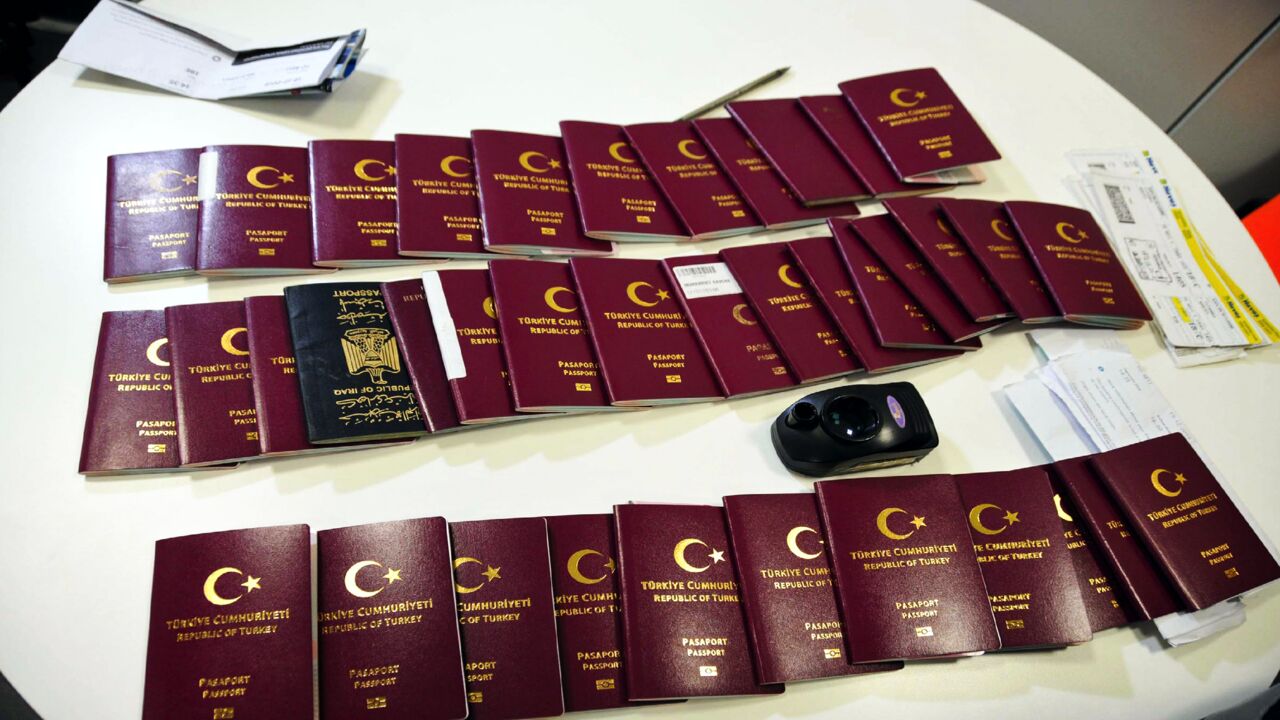 Fake passports and travel documents are displayed on a table for the press on Dec. 19, 2019, at the Istanbul airport in Turkey. 