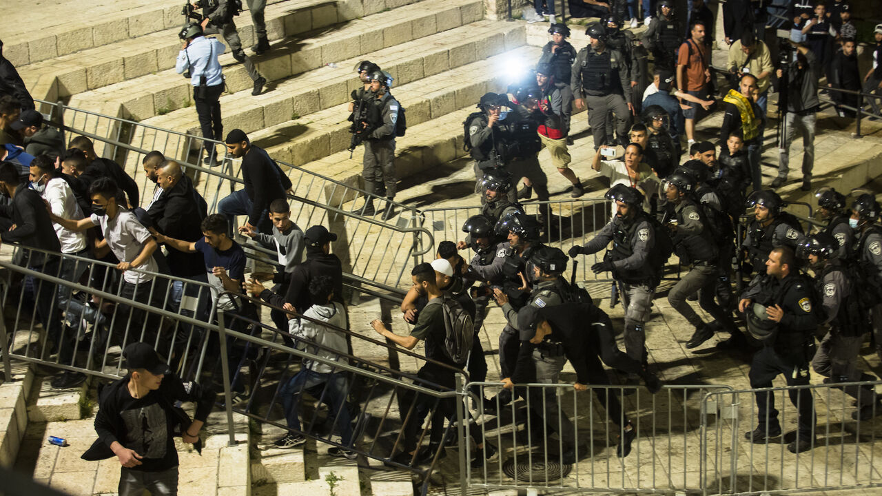 Israeli police officers clash with Palestinians during the holy Muslim month of Ramadan on April 24, 2021 in Jerusalem. 