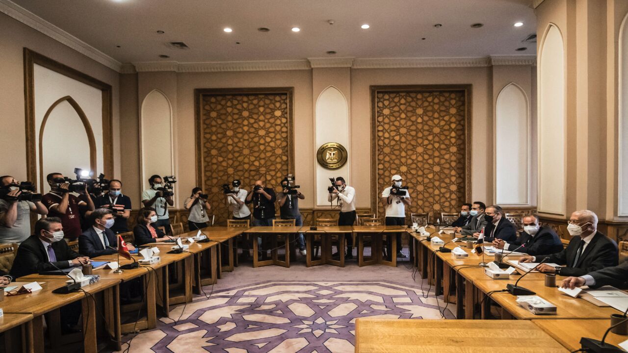 Egypt's Deputy Foreign Minister Hamdi Sanad Loza (R) meets with his Turkish counterpart, Sedat Onal (L), in the Foreign Ministry headquarters in the Egyptian capital, Cairo, on May 5, 2021.