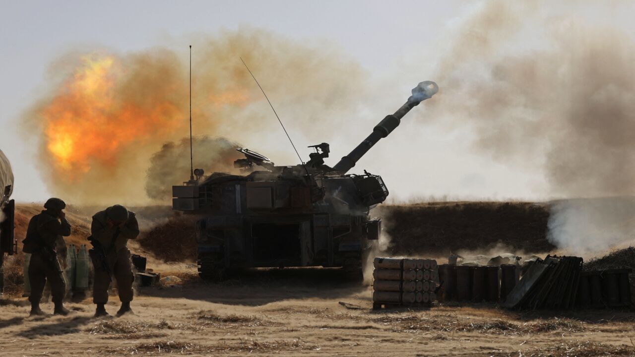 Israeli soldiers fire a 155 mm self-propelled Howitzer toward targets in the Gaza Strip from their position near the southern Israeli city of Sderot on May 12, 2021. Israel's Defense Minister Benny Gantz vowed more attacks on Hamas and other Palestinian militant groups in Gaza to bring "total, long-term quiet" before considering a cease-fire.