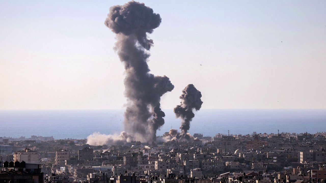 Smoke billows following an Israeli air strike in Rafah in the southern Gaza Strip on May 13, 2021.