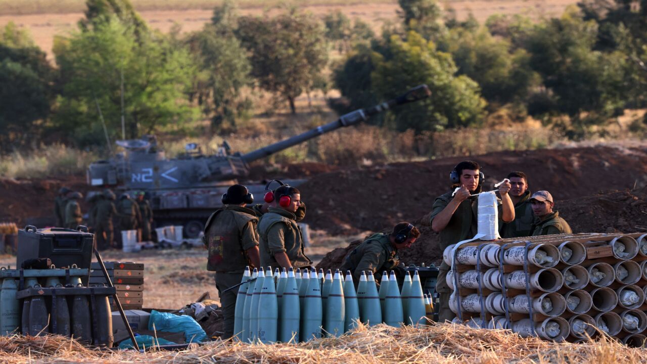 Israeli soldiers prepare a 155 mm self-propelled shell to fire toward the Gaza Strip from their position near the southern Israeli city of Sderot on May 13, 2021. Israel deployed additional troops to Gaza's border as the military conflict with Palestinian Islamists raged on, while inside Israel security forces scrambled to contain deadly riots between Jews and Arabs.