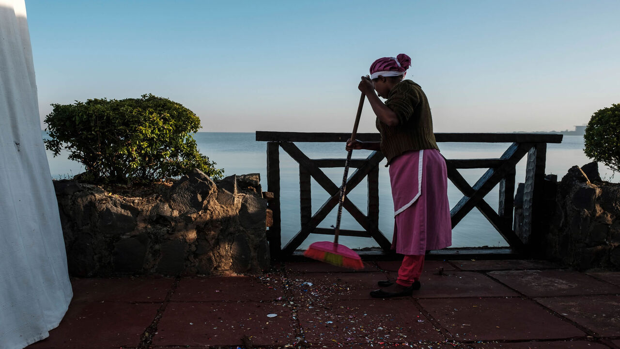 A worker cleans at a resort on the shore of Lake Tana, Bahir Dar, Ethiopia, Nov. 11, 2020. Lake Tana, a UNESCO biosphere reserve, is the origin of the Blue Nile River that feeds the Grand Ethiopian Renaissance Dam.