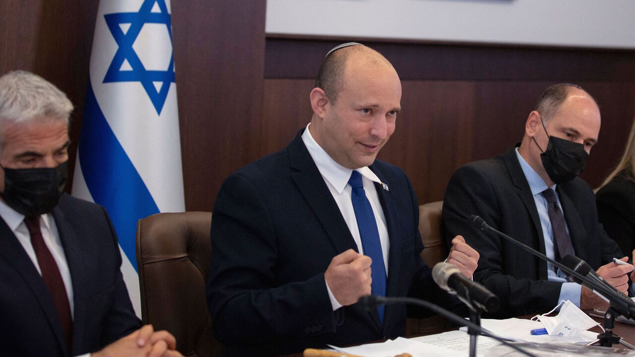 Israeli Prime Minister Naftali Bennett speaks as he chairs the weekly cabinet meeting in Jerusalem, on June 27, 2021. - The Israeli health ministry reimposed a requirement on June 25 for masks to be worn in enclosed public places, following a surge in Covid-19 cases since the rule was dropped 10 days earlier. 