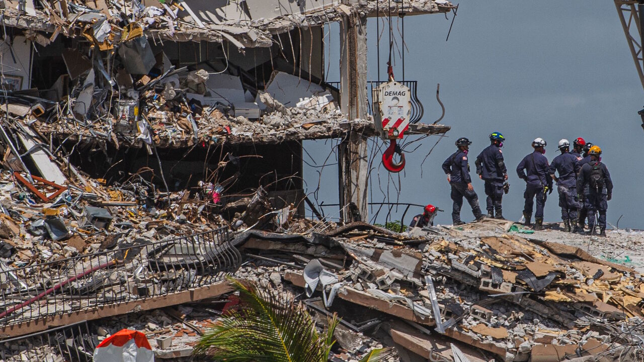 Search and Rescue teams look for possible survivors in the partially collapsed 12-story Champlain Towers South condo building on June 27, 2021 in Surfside, Florida.