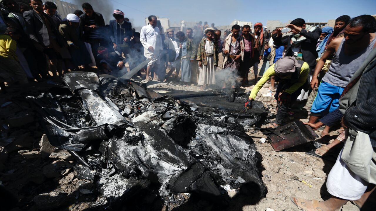 Yemenis inspect the burning wreckage of a drone in the country's capital, Sanaa, on Oct. 1, 2017.