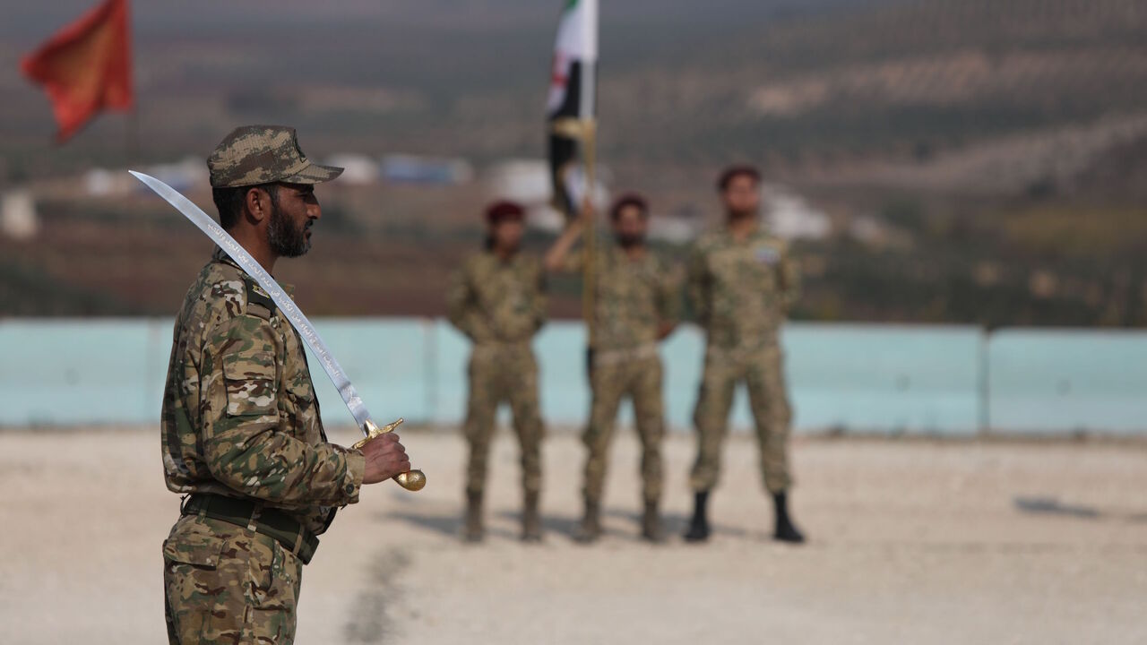 Turkish-backed Syrian fighters of the Sultan Murad Turkoman brigade are pictured during a military show in the Afrin region in the rebel-held northern countryside of Syria's northern Aleppo province on Nov. 17, 2020. 