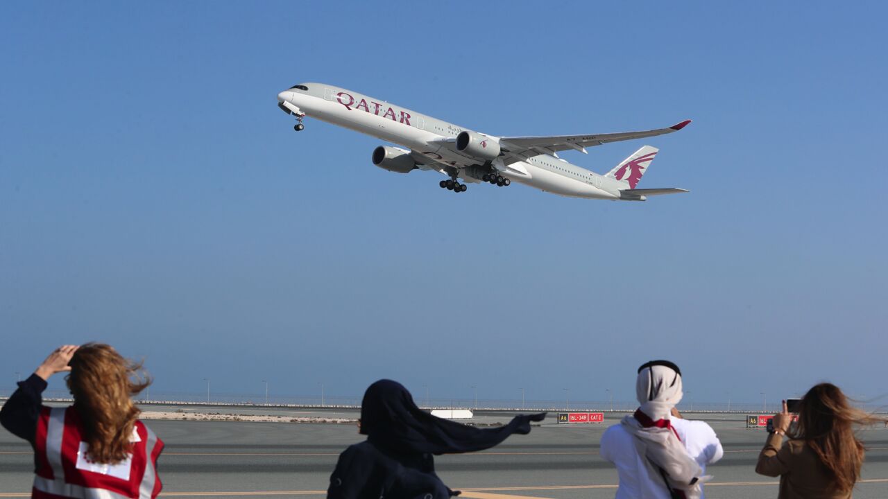 A Qatar Airways Airbus A350 airplane takes off from Hamad International Airport.