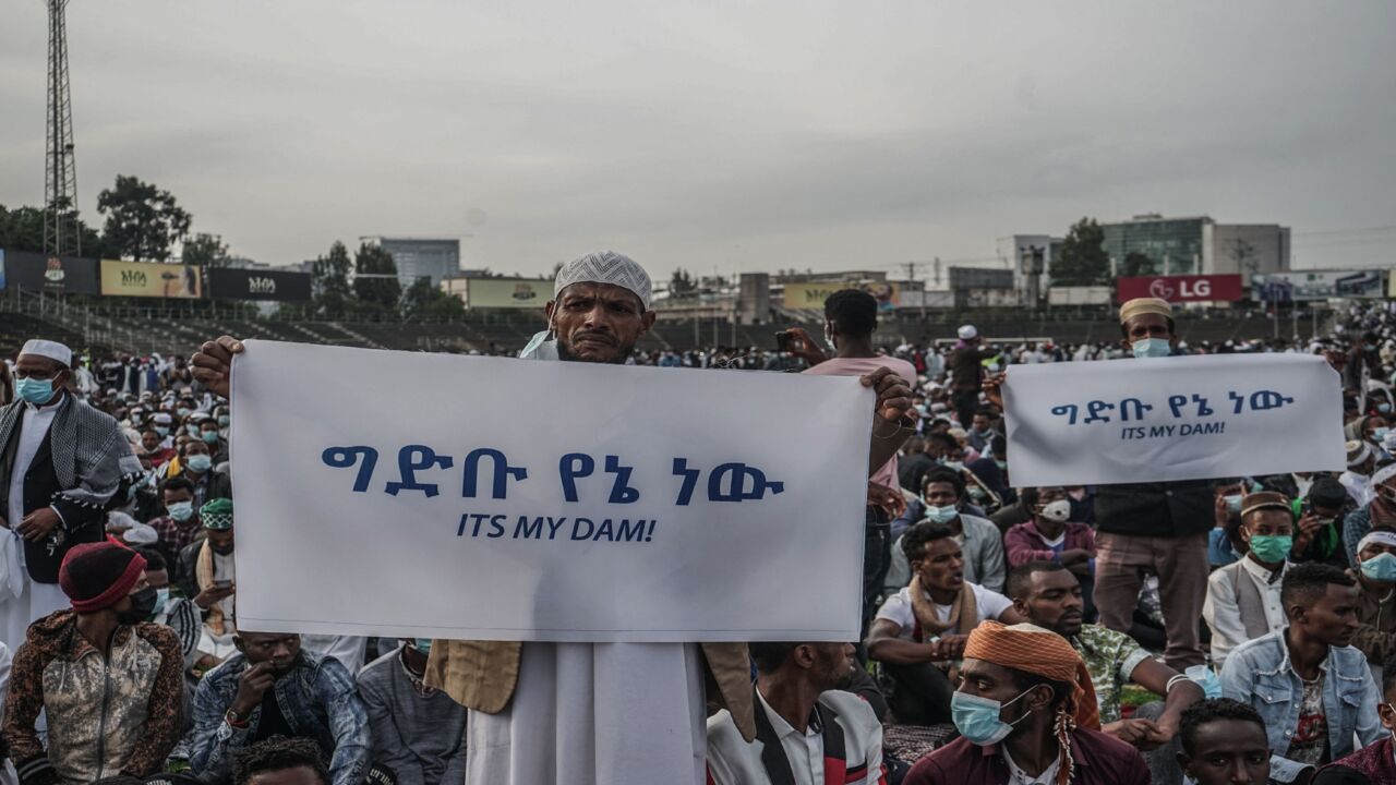 People hold placards to express their support for Ethiopia's megadam on the Blue Nile River.