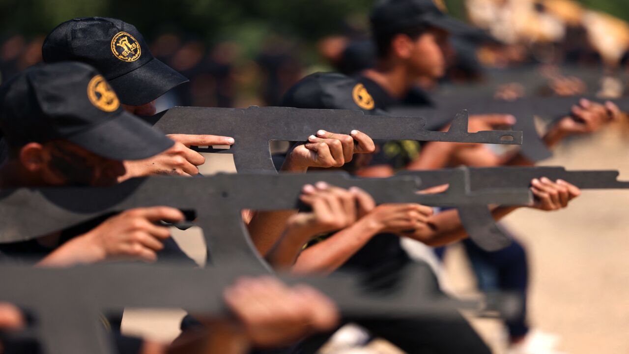 Palestinian youths attend a military summer camp organized by the Islamic Jihad Movement, in Gaza City, June 27, 2021. 