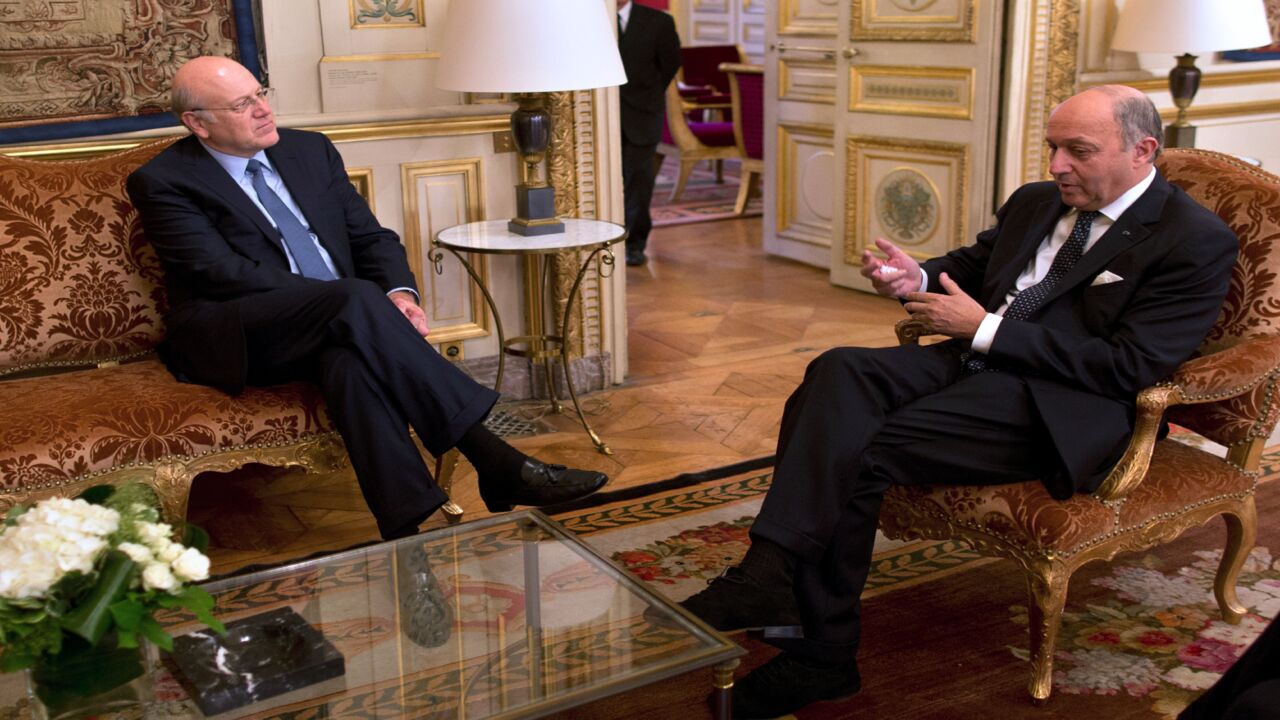 French Minister of Foreign Affairs Laurent Fabius (R) meets Lebanese Prime Minister Najib Mikati on November 26, 2013.