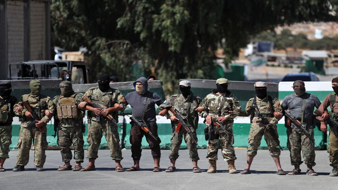 Jihadis of former al-Qaeda affiliate Hayat Tahrir al-Sham block demonstrators from approaching the Bab al-Hawa crossing.