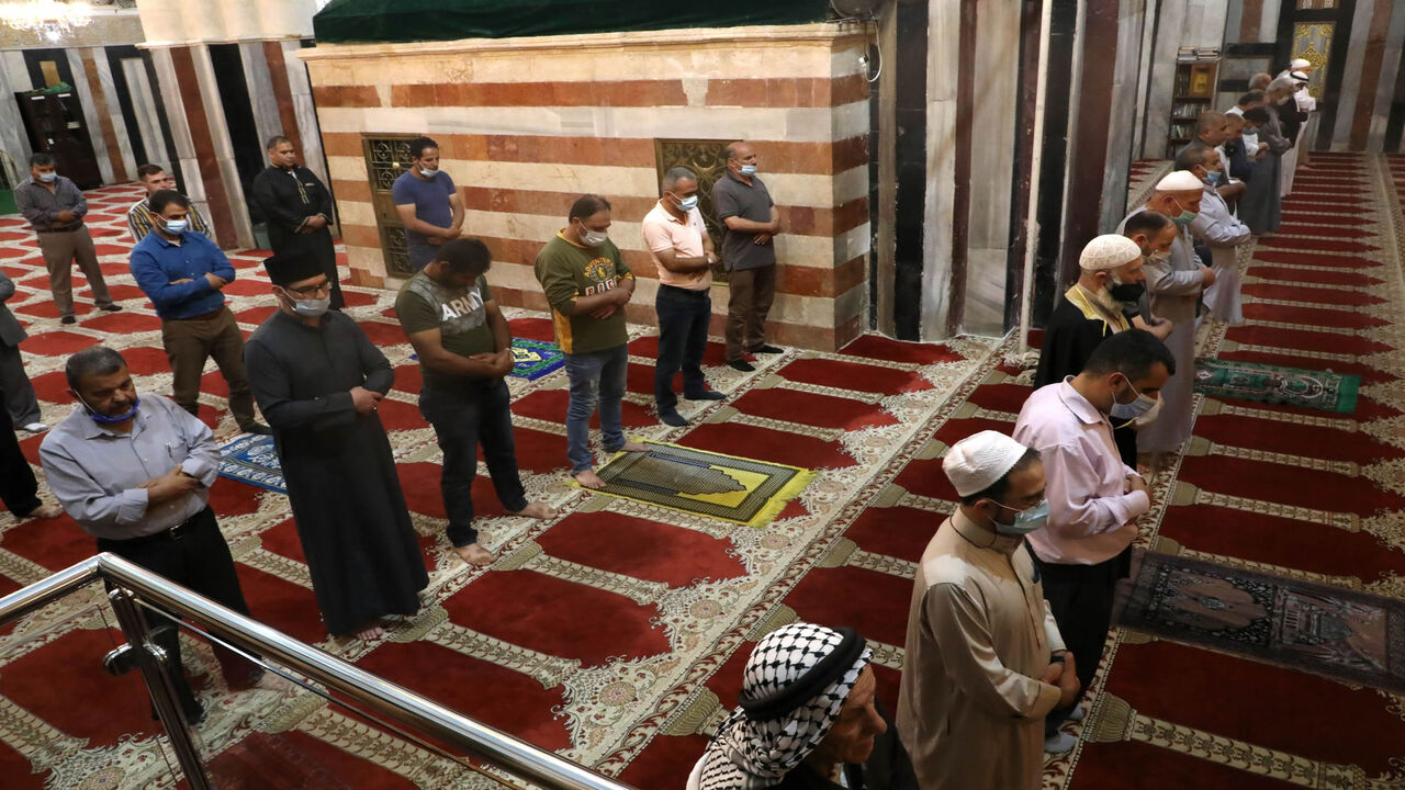 Palestinians wear face masks as they gather to perform the Friday prayers at the Ibrahimi mosque, also known as the Tomb of the Patriarchs, Hebron, West Bank, June 26, 2020.