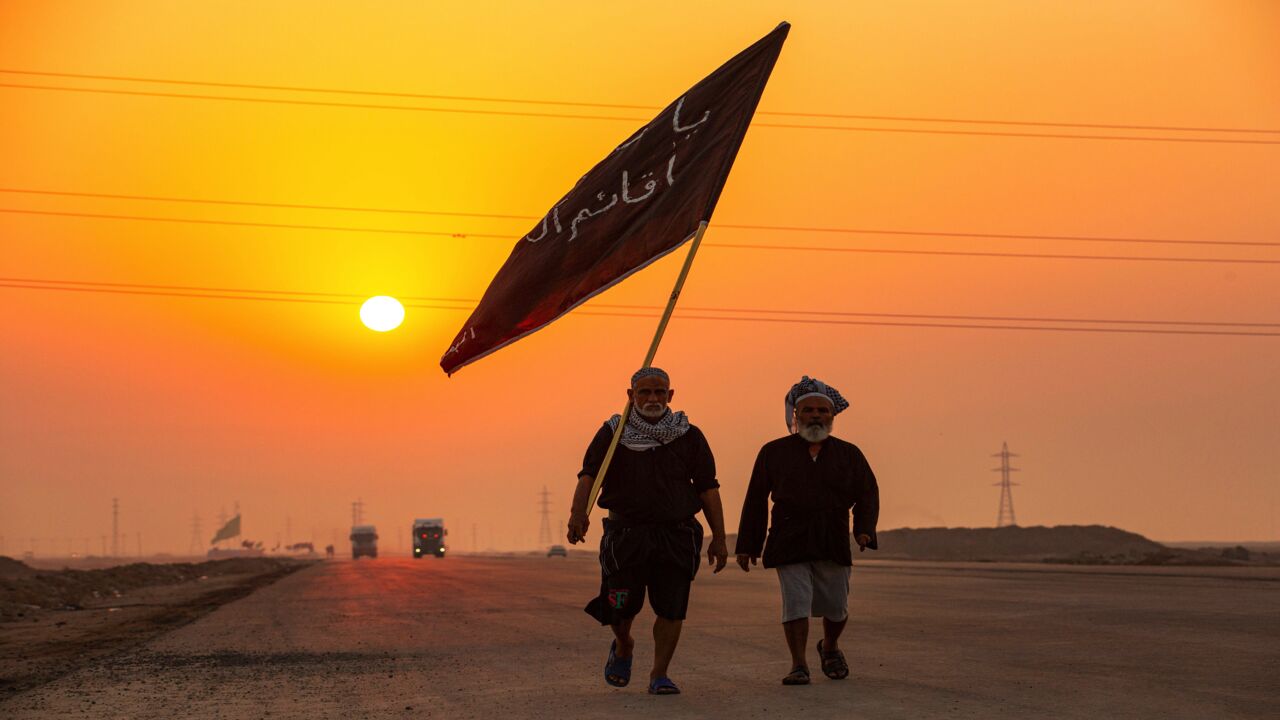 Iraqi Shiite Muslim pilgrims who began their march from the southern port city of al-Faw walk through Basra on their way to the holy city of Karbala ahead of the Arbaeen religious festival on Sept. 17, 2020.