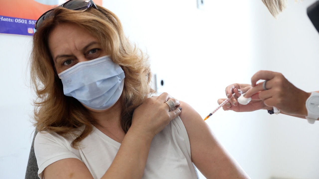 A woman receives a dose of Pfizer BioNTech vaccine against Covid-19 at the Ankara City Hospital, in Ankara, Turkey, on June 7, 2021.