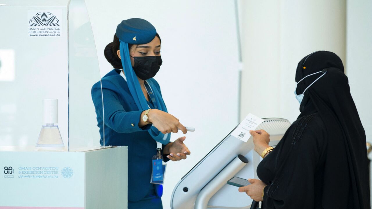 A woman arrives to get vaccinated at the Oman Convention & Exhibition Center in the capital, Muscat, on June 23, 2021.