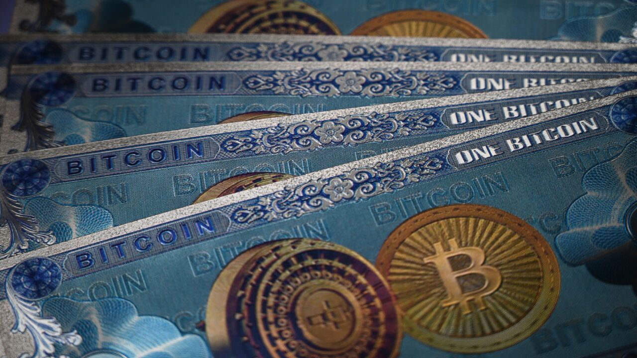 This illustration photograph taken on July 18, 2021, in Istanbul shows physical banknote imitations of the Bitcoin cryptocurrency.