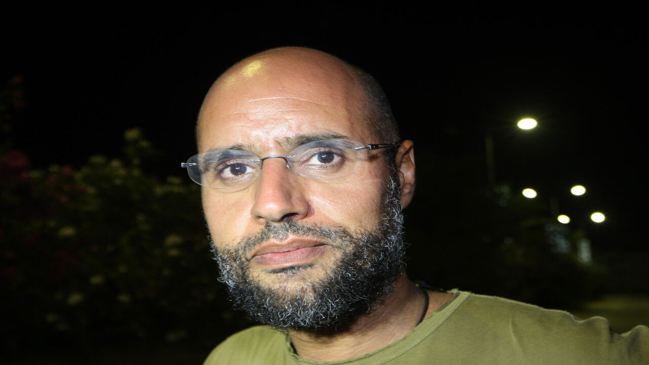 Seif al-Islam Gadhafi, son of Libyan leader Moammar Gadhafi, appears in front of supporters and journalists at his father's residential complex, Tripoli, Libya, Aug. 23, 2011. 