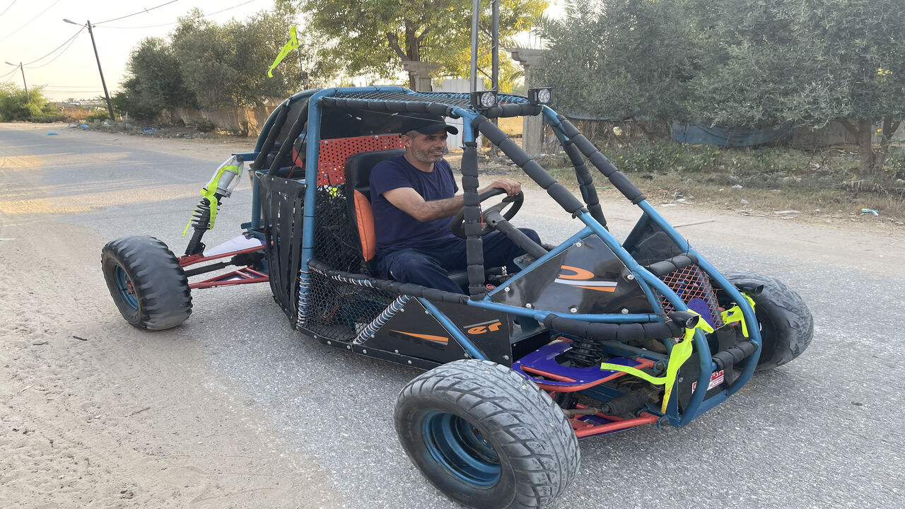 Fathi Salman Abu Gharaba is seen driving the "Desert Race" vehicle he built himself, al-Masdar, Gaza Strip.