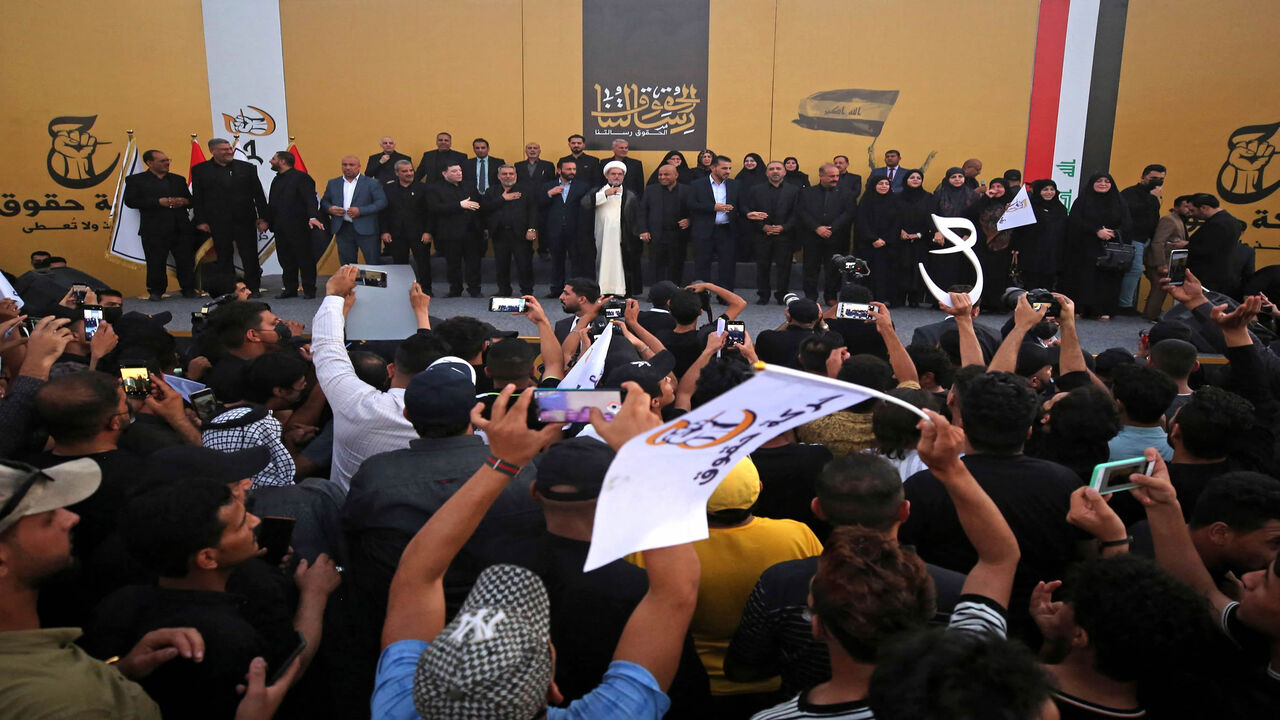 Candidates of the Huquq electoral list pose on stage during a campaign rally, Baghdad, Iraq, Sept. 3, 2021.