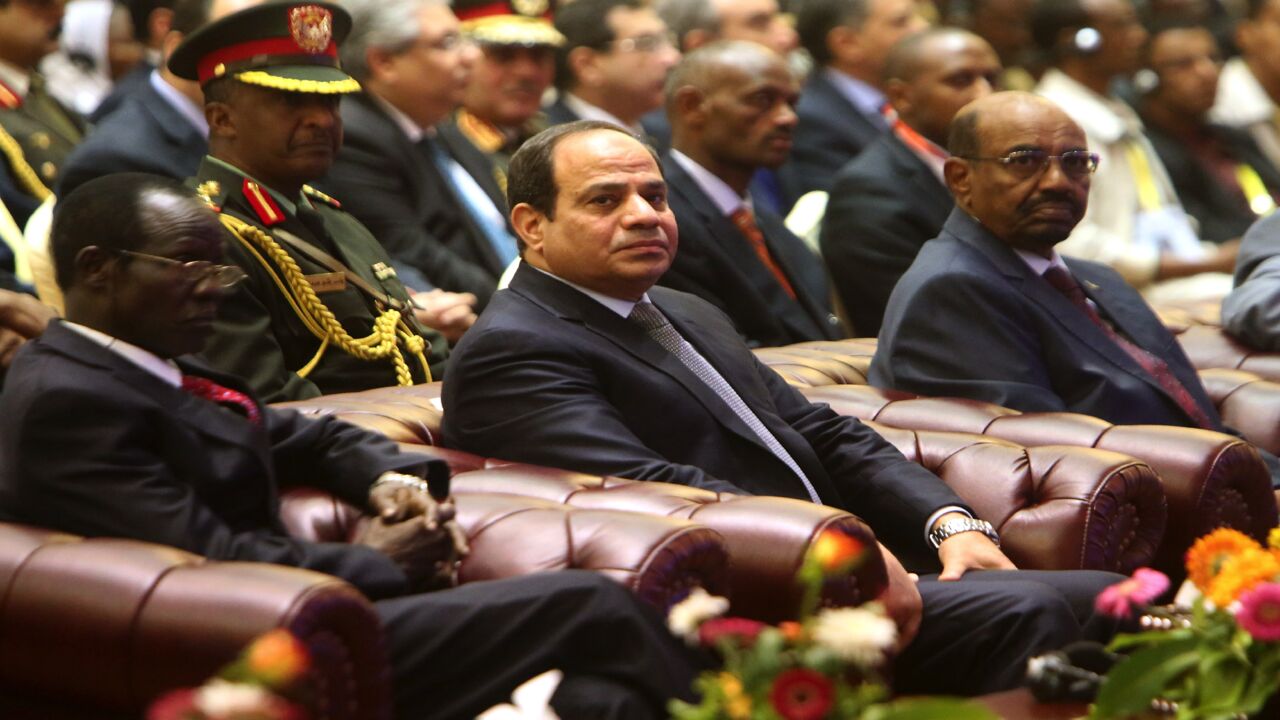 South Sudan's Vice President James Wani Igga (L), Egyptian President Abdel-Fattah al-Sisi (C) and Sudanese President Omar al-Bashir attend a meeting in the Sudanese capital, Khartoum, on March 23, 2015.