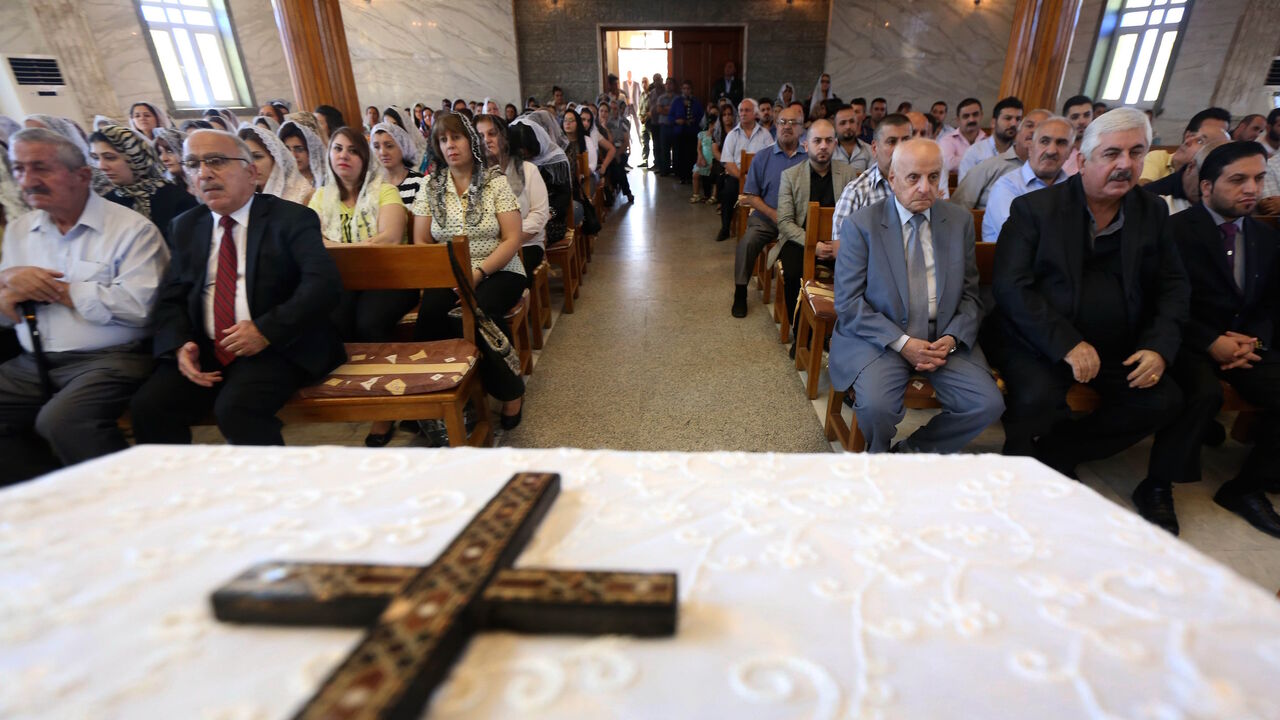 Iraqi Assyrian Christians attend a ceremony with the Holy Synod of the Assyrian Church of the East to elect a new Catholicos-patriarch of the Assyrian Church of the East, at Saint Youhanna church in Arbil, the capital of the autonomous Kurdish region of northern Iraq on Sept. 18, 2015.