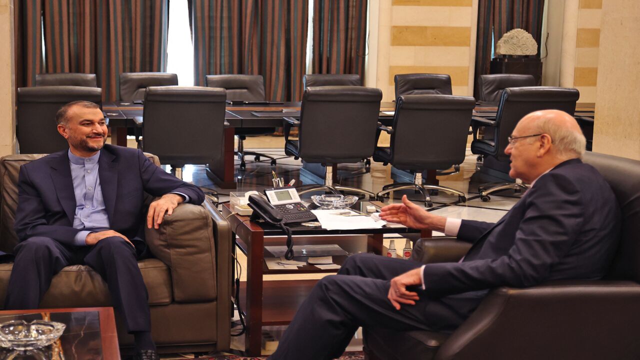 Lebanon Prime Minister Najib Mikati (R) and Iran's Foreign Minister Hossein Amir-Abdollahian meet in Beirut on Oct. 7, 2021.