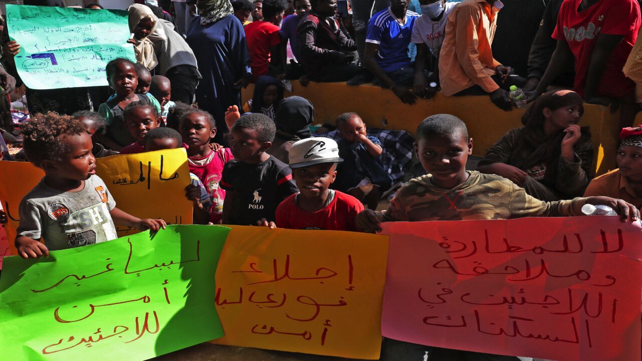 African migrants stage a demonstration outside the headquarters of the UN Refugee Agency in the Siraj area of the Libyan capital, Tripoli.