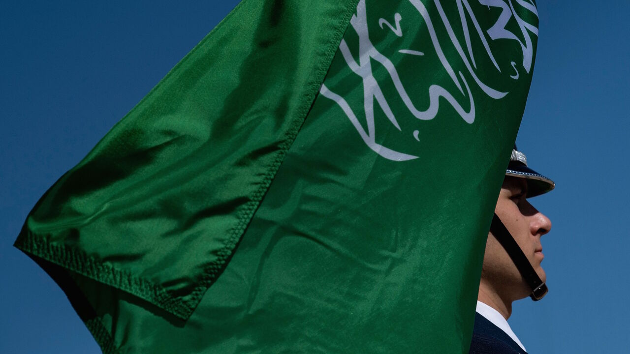 A color guard holds Saudi Arabia's flag while waiting for Saudi Vice Minister of Defense Prince Khalid bin Salman arrival for an honor cordon at the Pentagon August 29, 2019, in Washington, DC.