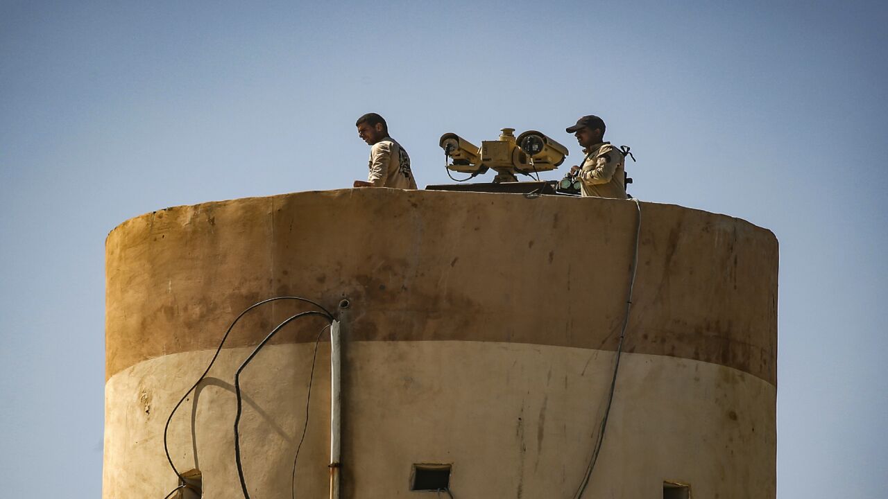 This picture taken on Sept. 27, 2020, from the Palestinian side of the border between the Gaza Strip and Egypt in Rafah shows Egyptian soldiers.