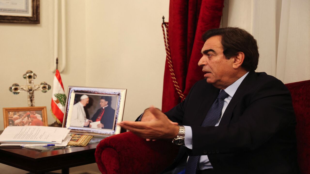 Lebanon's Information Minister George Kordahi meets with Cardinal Mar Bechara Boutros al-Rahi (unseen).