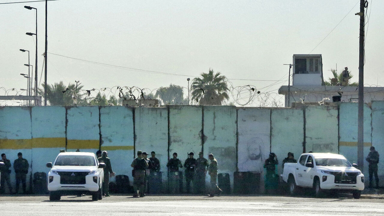 Iraqi security forces take position on Nov. 7, 2021 at one of the entrances of the Green Zone in the Iraqi capital, following an overnight drone attack on the residence of Iraq's prime minister inside the zone.