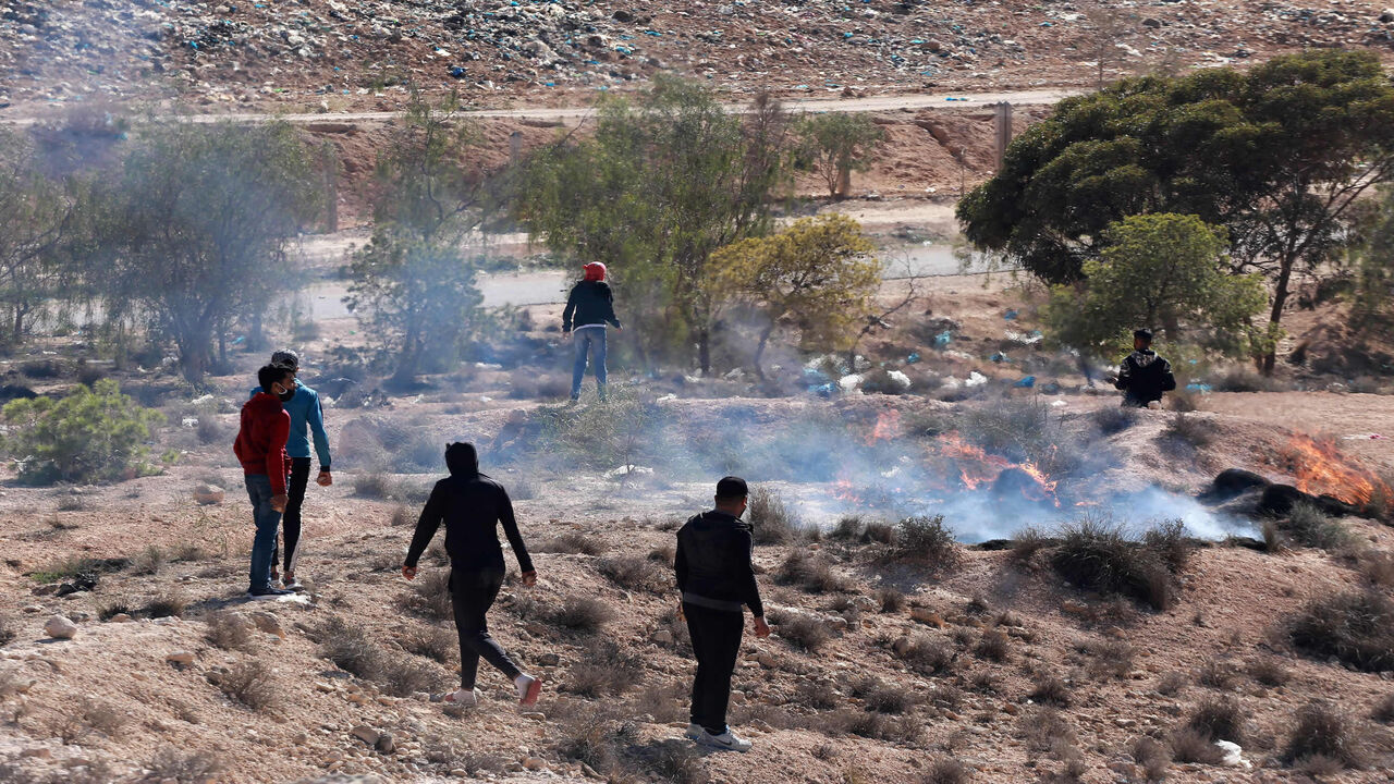 Demonstrators burn tyres during a general strike following the death of a protester and the reopening of a rubbish dump, Aguereb, Tunisia, Nov. 10, 2021.