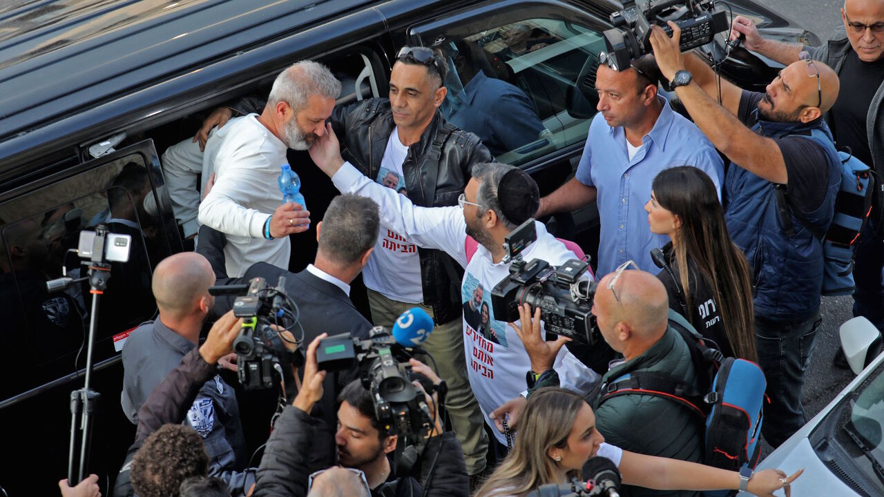 Israeli couple Mordi and Natalie Oknin, who were held in Turkey for a week on suspicion of espionage, are greeted upon their arrival home in the Israeli city of Modiin on Nov. 18, 2021 following their release.  