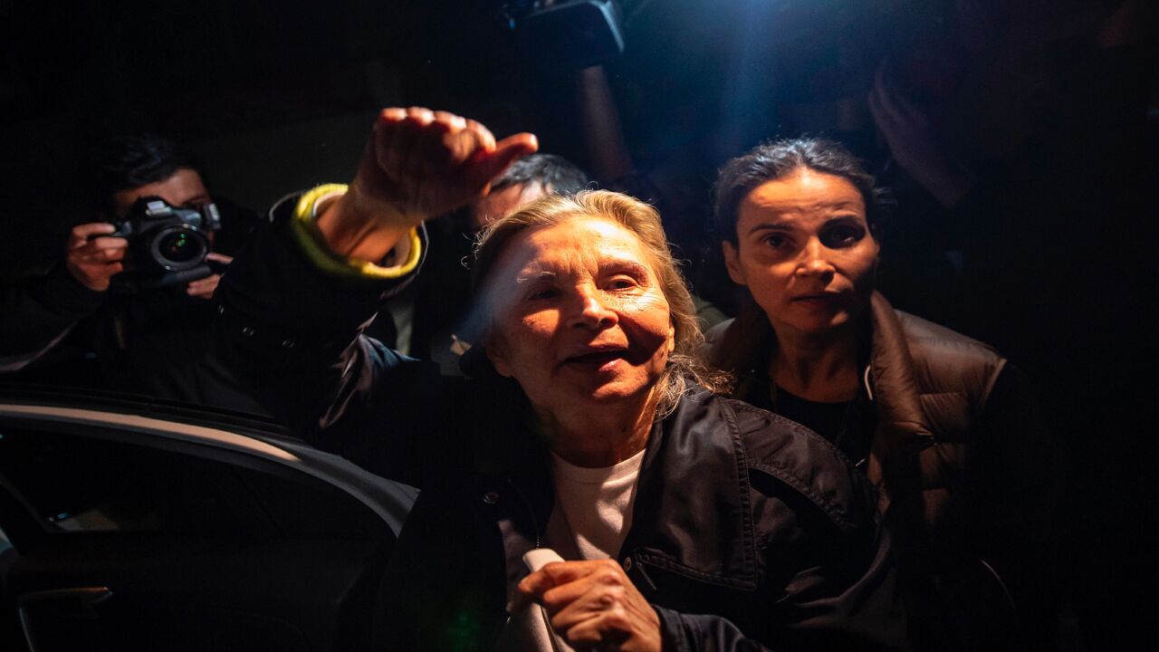 Turkish journalist Nazli Ilicak waves after being released from Bakirkoy women's prison on Nov. 4, 2019, in Istanbul. 