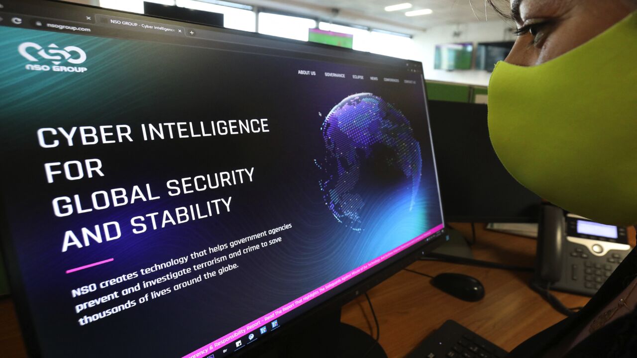 A woman checks the website of Israel-made Pegasus spyware at an office in the Cypriot capital, Nicosia, on July 21, 2021.