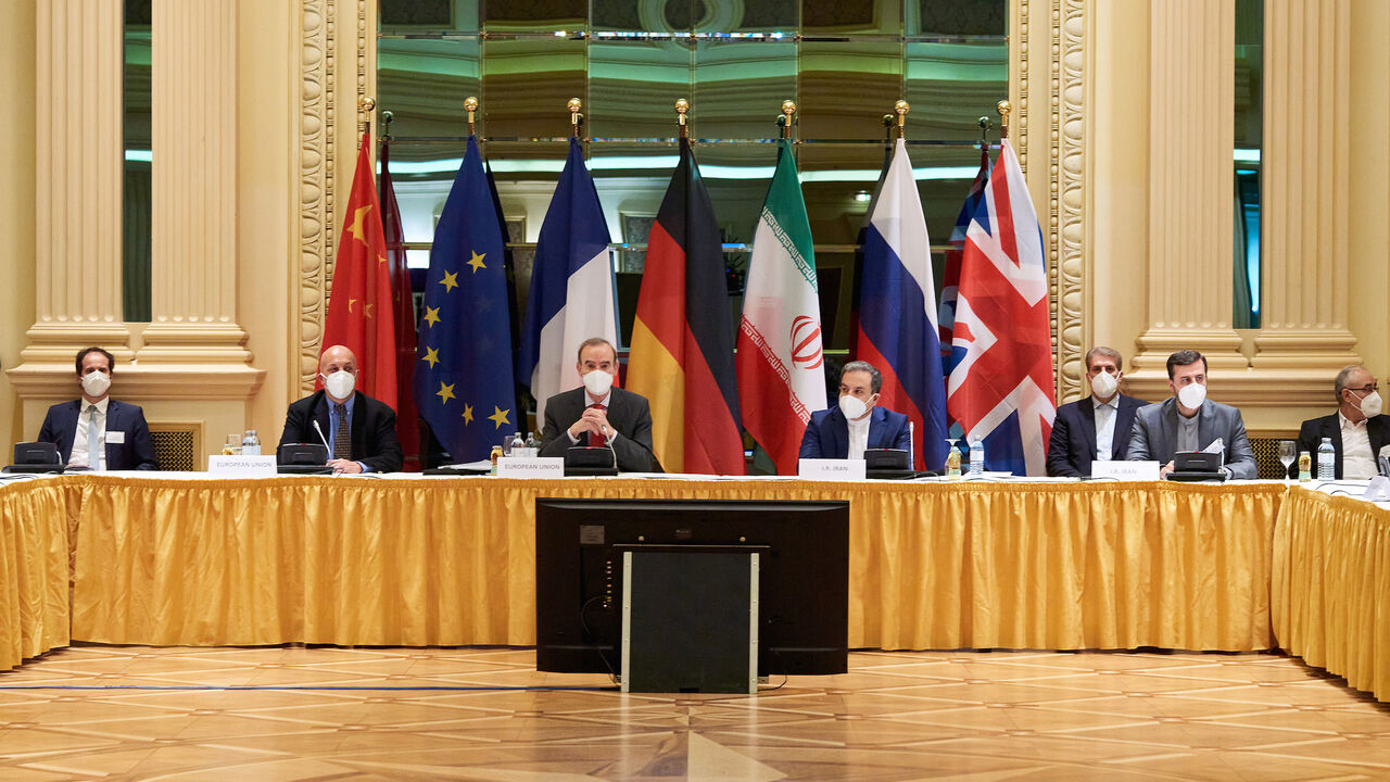In this handout provided by the EU Delegation in Vienna, Representatives of the European Union (L) and Iran (R) attend the Iran nuclear talks at the Grand Hotel on April 06, 2021 in Vienna, Austria.