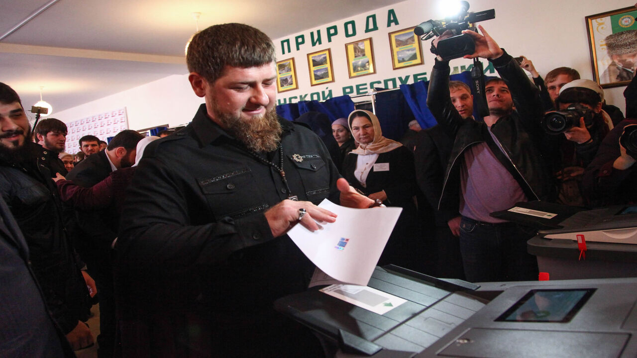 Chechnya's leader Ramzan Kadyrov casts his ballot as he votes during Russia's presidential election at a polling station in the settlement of Tsentoroy, outside Grozny, March 18, 2018.