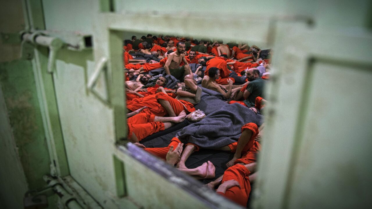 Men suspected of being affiliated with the Islamic State gather in a prison cell in the northeastern Syrian city of Hasakeh on Oct. 26, 2019. 