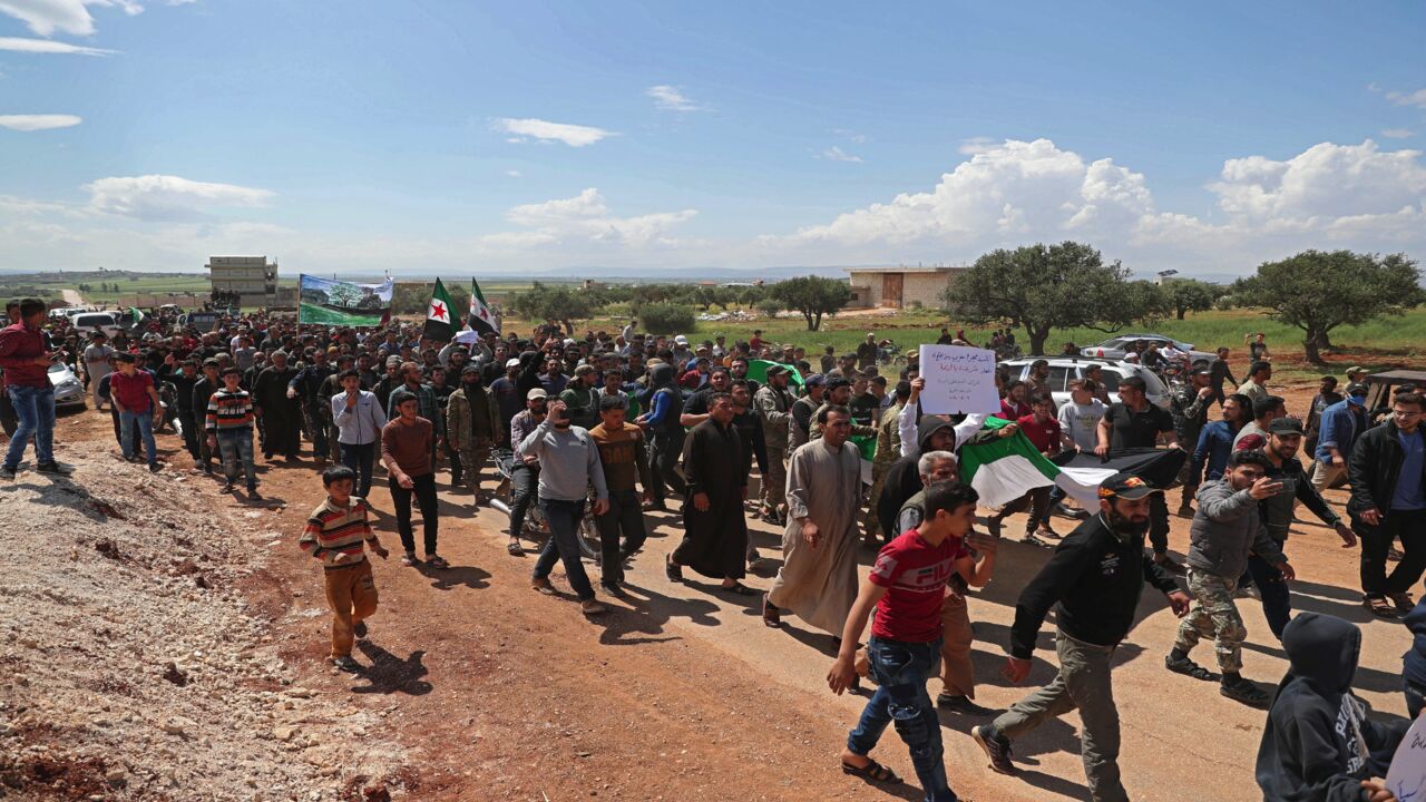 Syrian demonstrators gather during a protest in Syria's Idlib province on May 1, 2020, to protest a reported attack by Hayat Tahrir al-Sham.