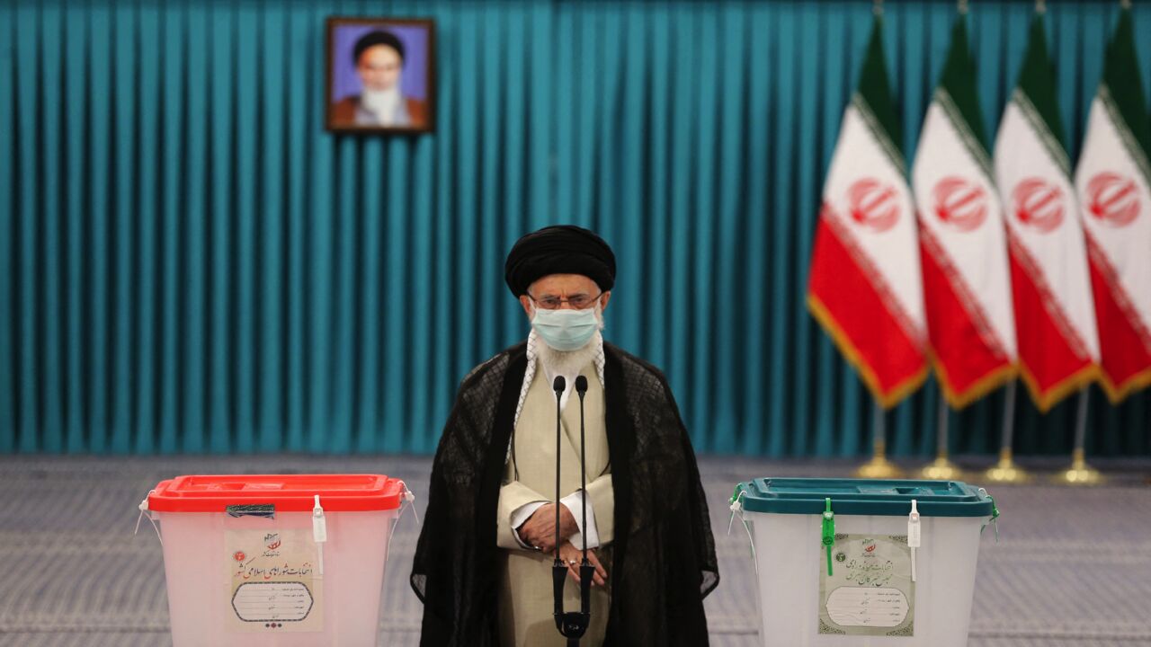 Iran's Supreme Leader Ayatollah Ali Khamenei wears a face mask due to the COVID-19 pandemic, on June 18, 2021.