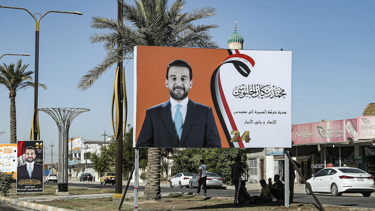 This picture taken on Sept. 26, 2021 shows an electoral campaign billboard ahead of Iraq's early legislative elections, depicting current parliament speaker Mohamed al-Halbousi, along the side of a road in the city of Ramadi, the capital of Iraq's central Anbar Governorate.