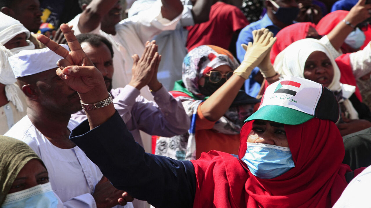 A Sudanese demonstrator flashes the victory sign during a rally in al-Daim neighborhood, Khartoum, Jan. 2, 2022.