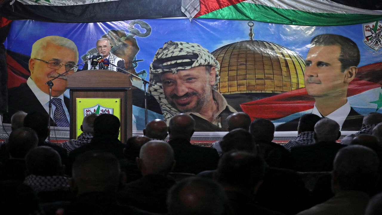 Samir al-Rifai, the Palestinian ambassador to Syria, speaks during a ceremony marking the 57th anniversary of the Fatah movement's foundation at the ravaged Yarmouk camp, south of Damascus, Syria, Jan. 7, 2022.