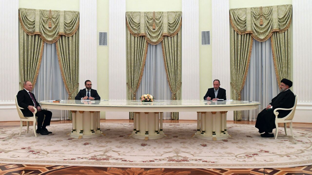 Russian President Vladimir Putin (L) speaks with Iranian President Ebrahim Raisi (R) during their meeting in Moscow on Jan. 19, 2022.