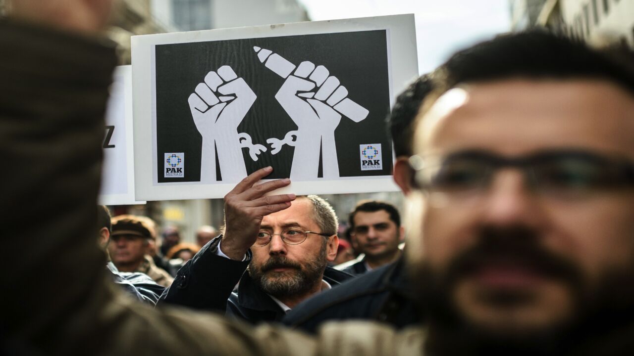 Journalists hold placards on Jan. 10, 2016, during a march on Journalism Day on Istiklal Ave. in Istanbul, as they protest the imprisonment of journalists.