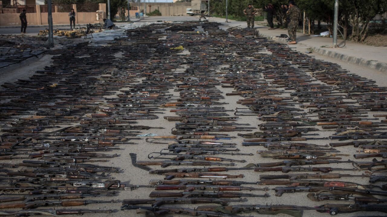 Seized Islamic State weapons found in the last stronghold of the extremist group are displayed on March 22, 2019, Al Mayadin, Syria.